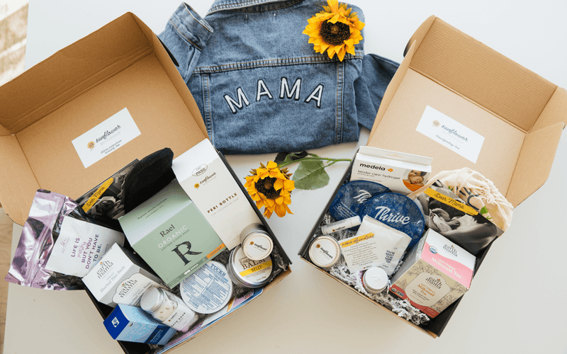 Sunflower Motherhood self-care gift boxes for new moms, featuring thoughtful postpartum essentials and wellness products surrounded by bright yellow sunflowers