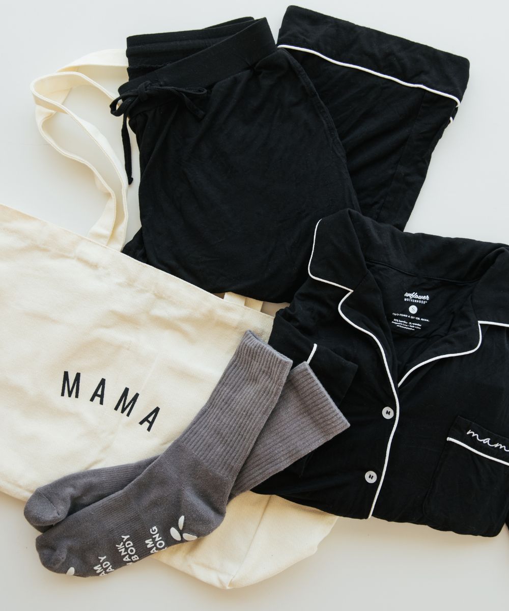 A black pajama set with a tote bag and socks, perfect for a cozy night in or lounging around.