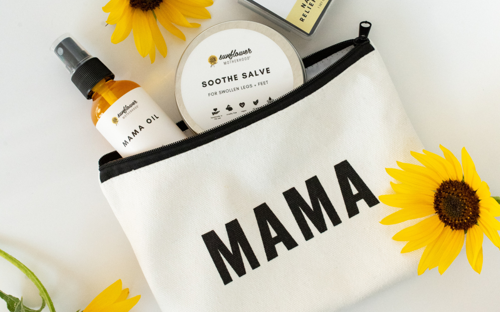 A white bag with sunflowers and a bottle of mama, representing a cheerful and nurturing vibe.