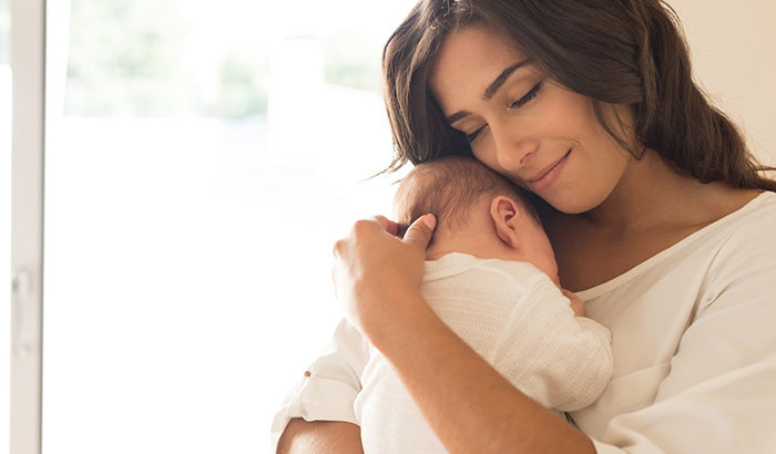A Postpartum Care Package For New Moms, Including Essential Items To Support Recovery And Well Being After Childbirth.