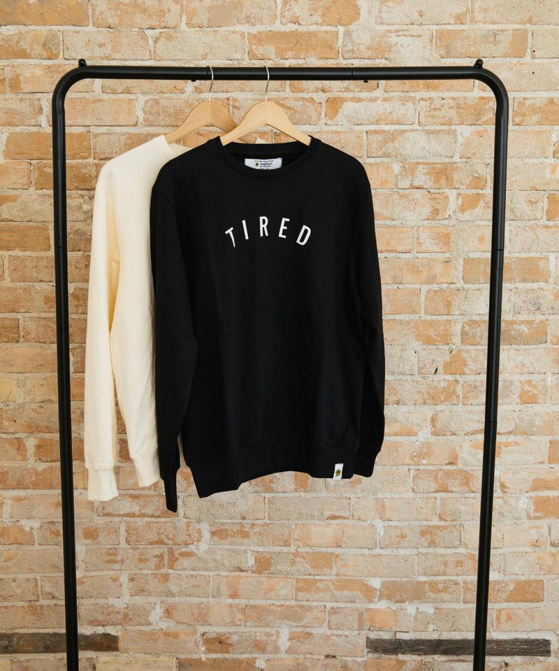 black and white long sleeve written tired