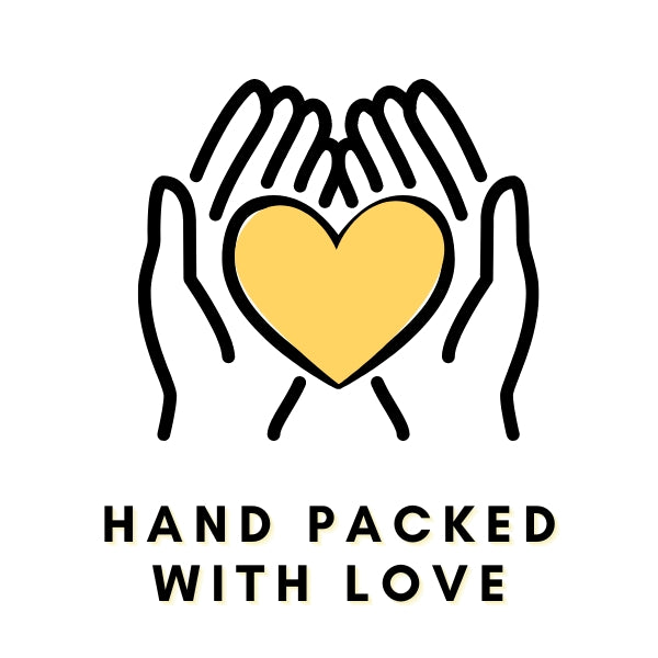 A hand gently packing items with care, symbolizing love and attention in every detail of the process.